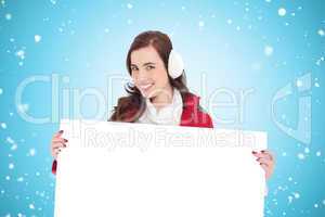 Composite image of beautiful brunette showing white poster