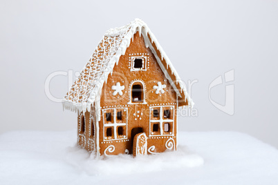 The hand-made eatable gingerbread house and snow decoration