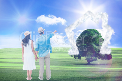 Composite image of happy hipster couple holding hands and lookin