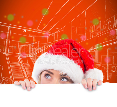 Composite image of festive blonde showing large poster