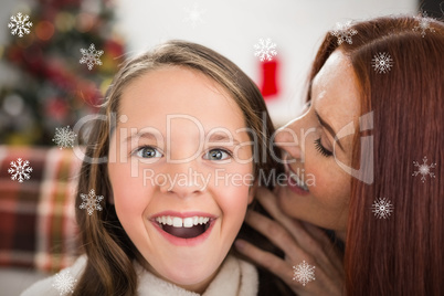 Composite image of mother telling her daughter a christmas secre