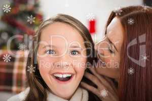 Composite image of mother telling her daughter a christmas secre