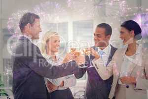 Composite image of business team celebrating with champagne and