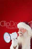 Composite image of santa claus is using a megaphone