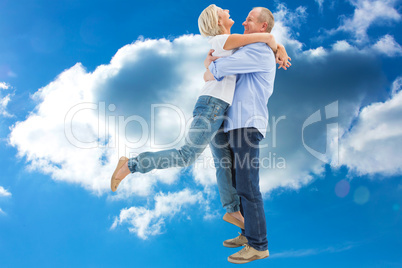 Composite image of mature couple hugging and having fun