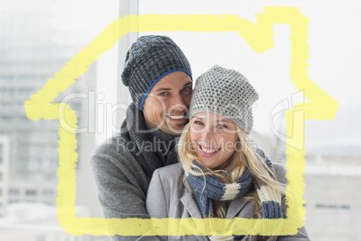 Composite image of cute couple in warm clothing smiling at camer