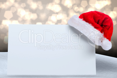 Composite image of santa hat on poster