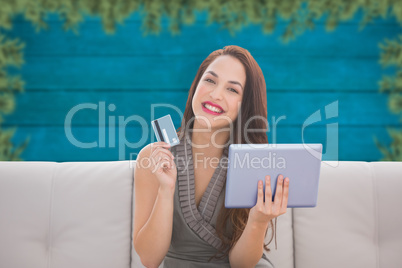 Composite image of woman on tablet