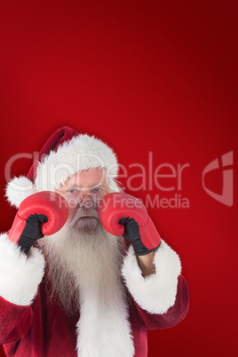 Composite image of santa claus is ready to fight