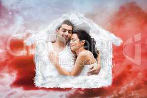 Composite image of beautiful couple lying on a bed