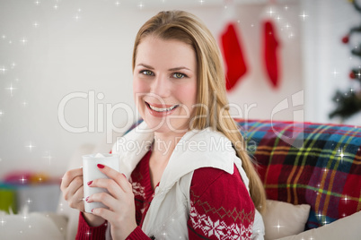 Composite image of portrait of woman having coffee on couch