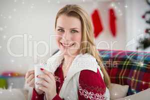 Composite image of portrait of woman having coffee on couch