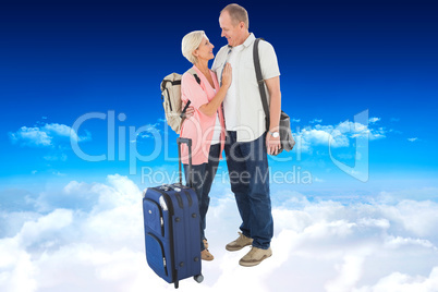 Composite image of smiling older couple going on their holidays