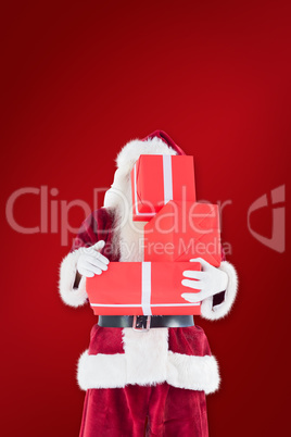 Composite image of santa covers his face with presents