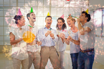 Composite image of casual business team celebrating with champag