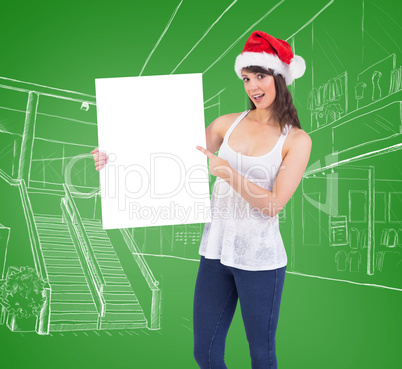 Pretty girl in santa hat holding poster