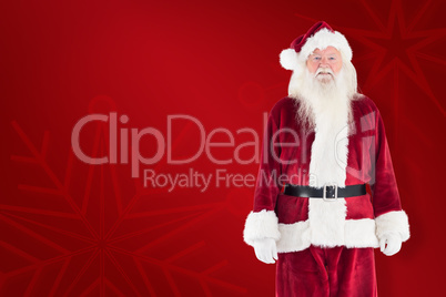 Composite image of jolly santa smiling at camera