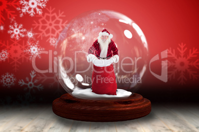 Santa holding open sack snow globe