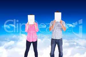 Composite image of people holding sheets over faces