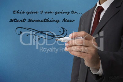Composite image of classy businessman holding a marker