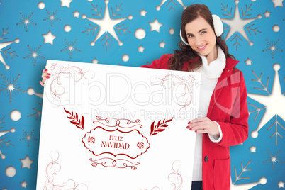 Composite image of happy brunette showing white poster