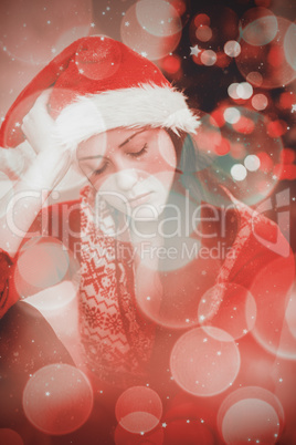 Composite image of festive brunette feeling sad at christmas