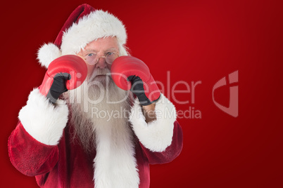Composite image of santa claus is ready to fight