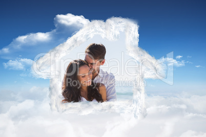 Composite image of affectionate couple cuddling