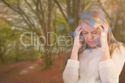 Composite image of pretty blonde getting a headache on the couch