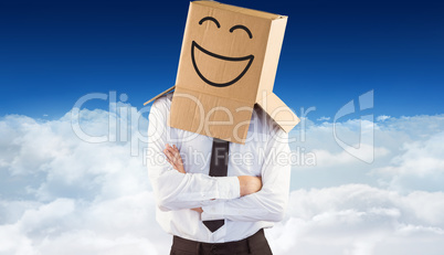 Composite image of anonymous businessman with arms crossed