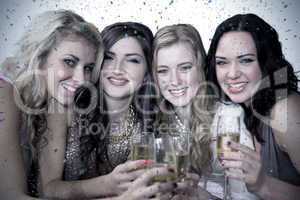 Composite image of friends drinking champagne