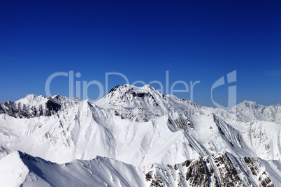 Snowy mountains in sun day