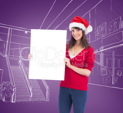 Festive brunette holding a poster