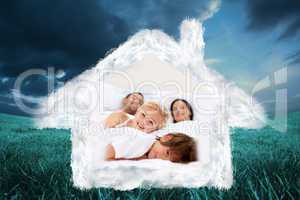 Composite image of family realxing in parents bed