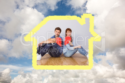 Composite image of couple holding a broken heart