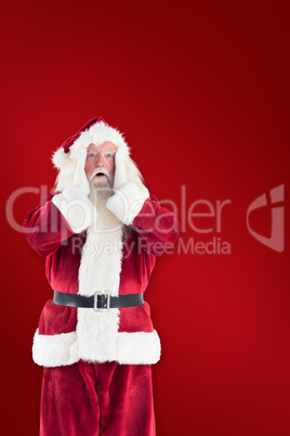 Composite image of santa is shocked to camera