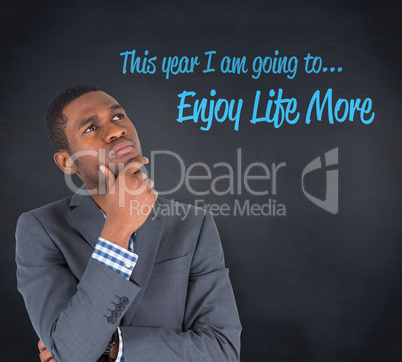 Composite image of young businessman thinking