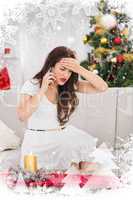 Composite image of concentrated brunette on the phone on christmas day
