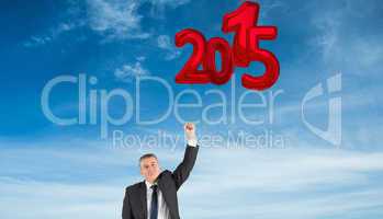 Composite image of mature businessman cheering with arm up