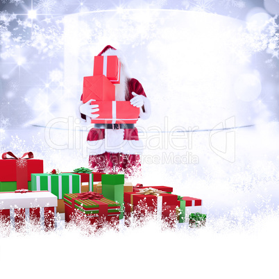 Composite image of santa covers his face with presents