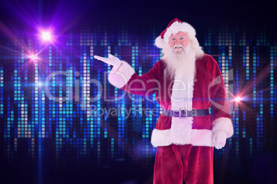 Composite image of santa shows something to camera