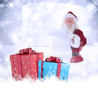 Composite image of father christmas holds a list