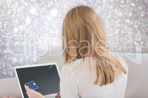 Composite image of blonde shopping online
