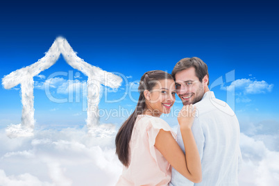 Composite image of attractive young couple smiling at camera