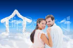 Composite image of attractive young couple smiling at camera