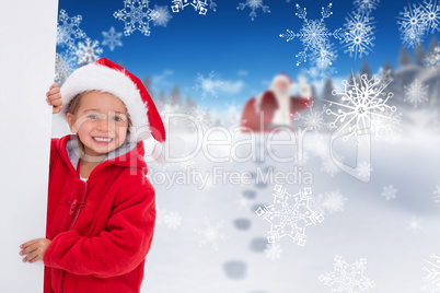 Composite image of festive little girl holding poster