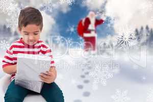 Composite image of cute little boy opening gift