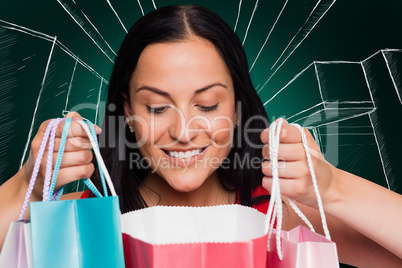 Composite image of woman standing with shopping bags