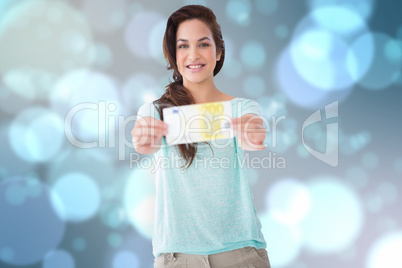 Composite image of pretty brunette showing a bill