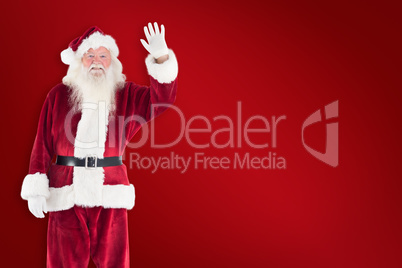 Composite image of jolly santa waving at camera